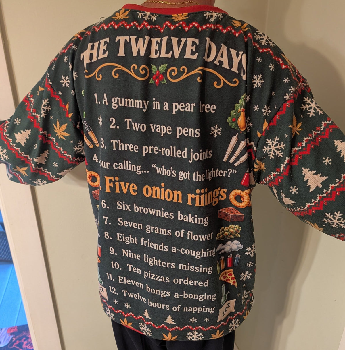 Real photo of the back of the 12 Days of a Weed Smoking Christmas ugly sweatshirt with the full Twelve Days list – Couch & Cart